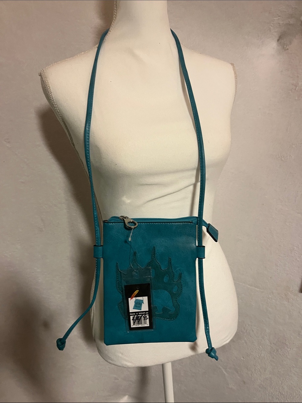 Teal leather crossbody bag with bear paw stitch